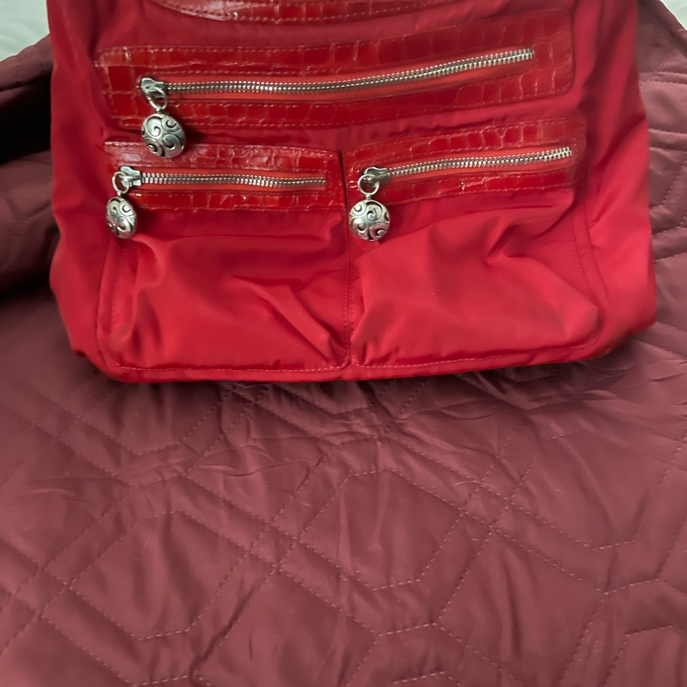Red leather and nylon  Brighton crossbody bag. Lots of room! Needs a cleaning.